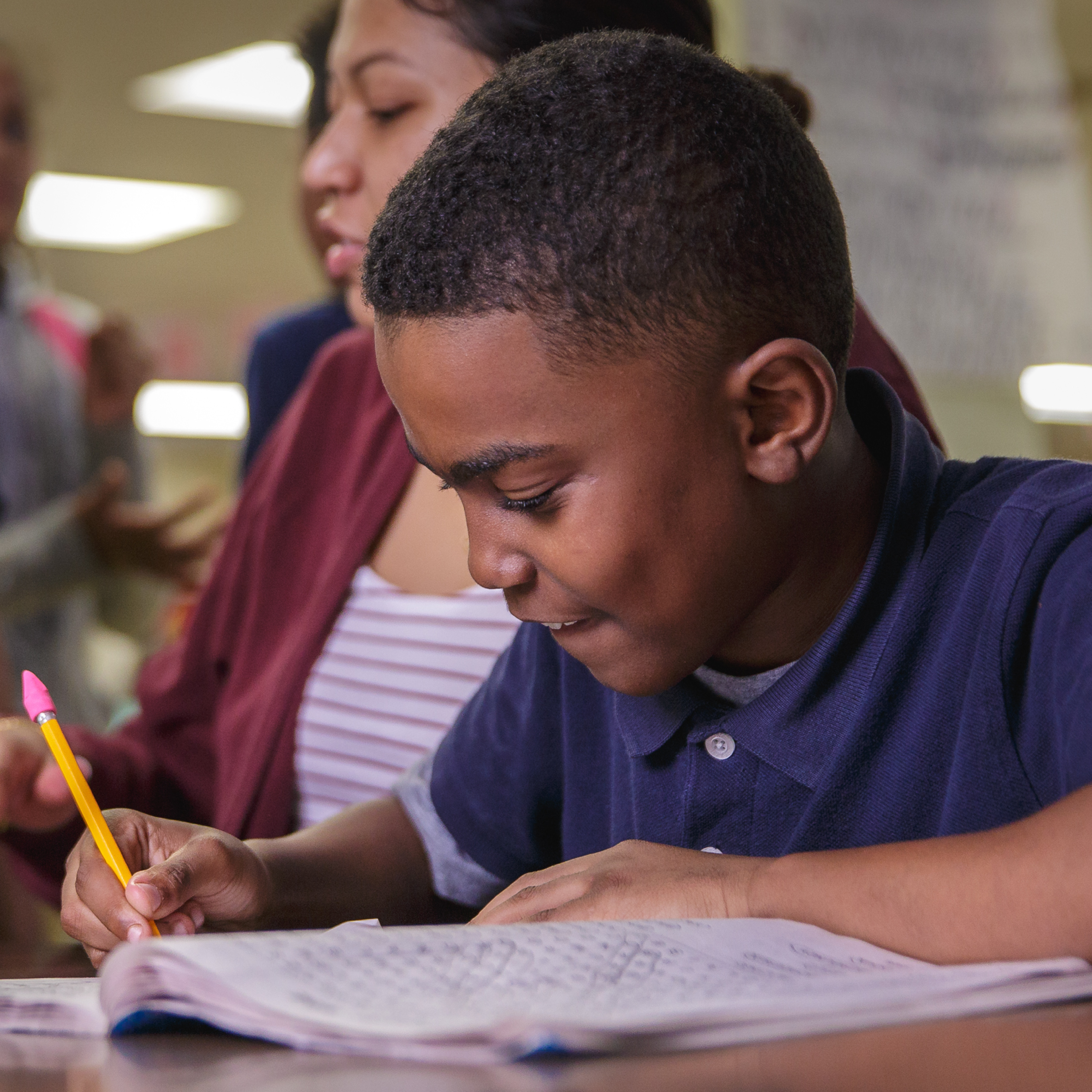 Afterschool participant does his homework